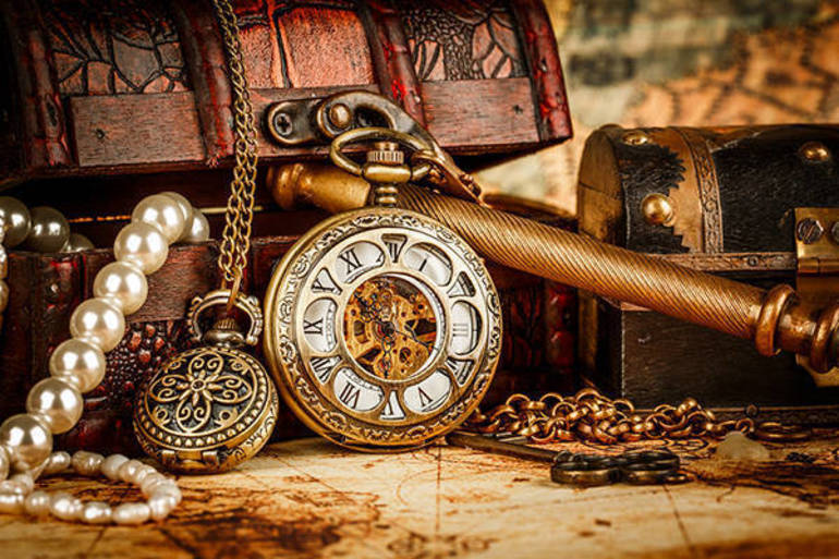 Expert authenticating antique artifacts
